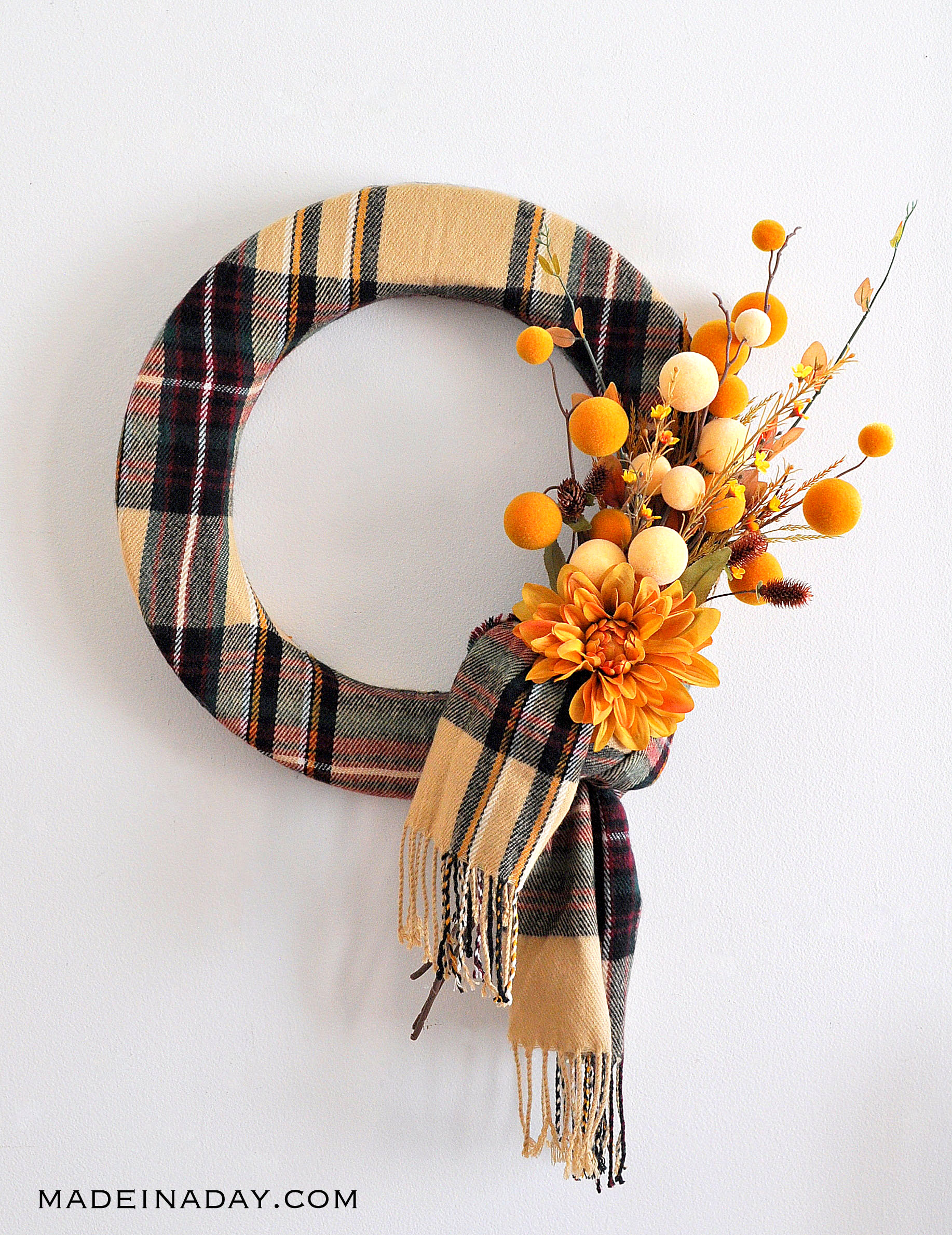 Beautiful DIY Thanksgiving wreaths adorned with autumn leaves, pumpkins, and berries.