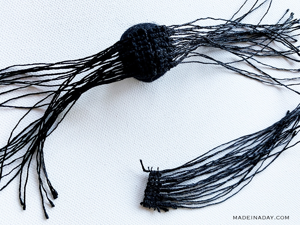 DIY felt ball spider from fringe